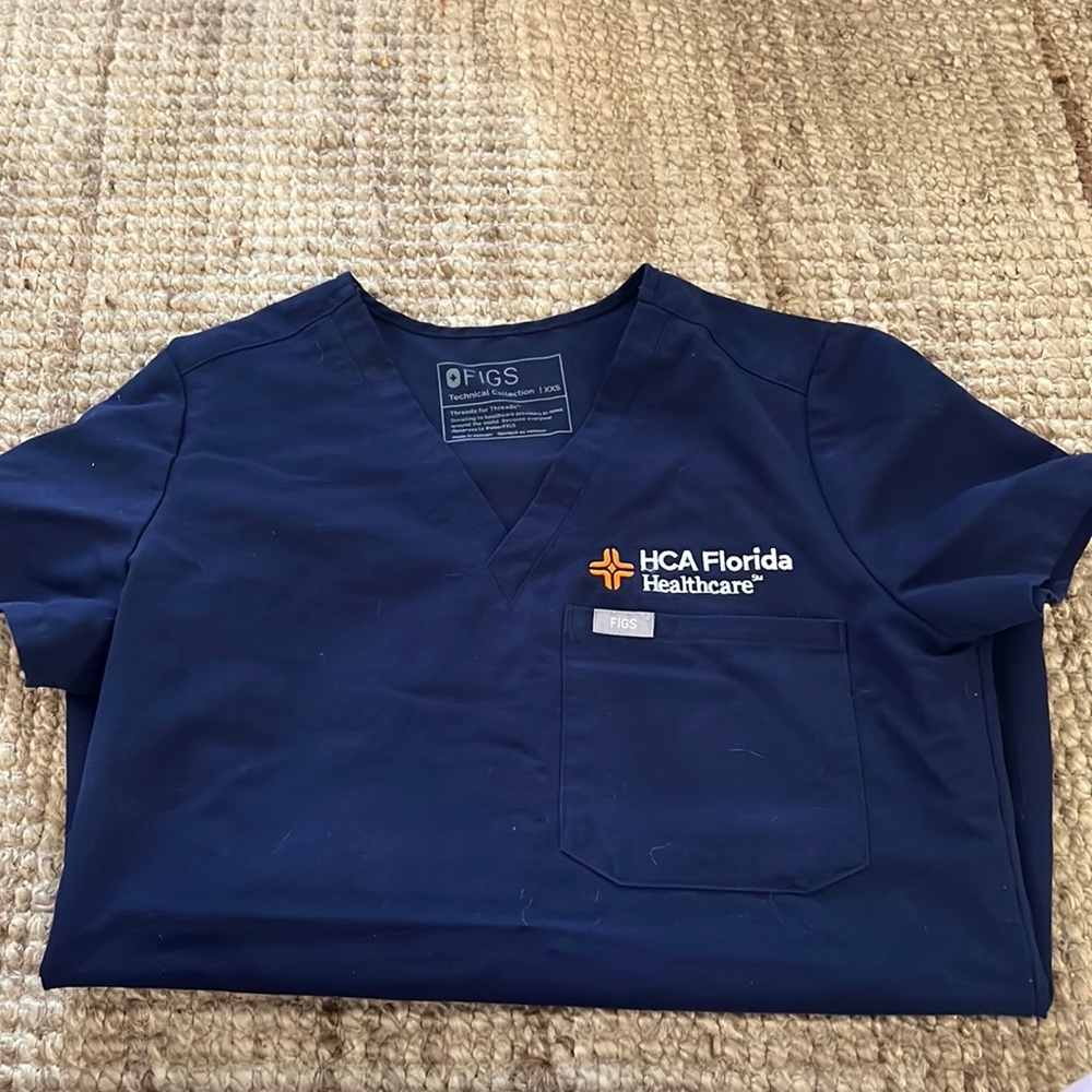 Figs scrub top with HCA logo